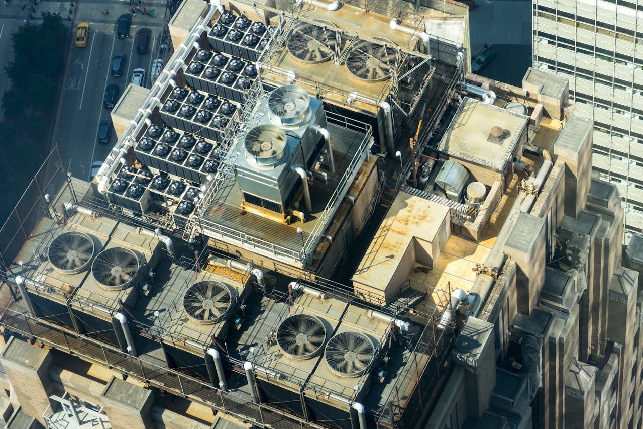 The Art of Drawing Readers In: Your attractive post title goes here High-angle shot of HVAC units on a city buildings rooftop, showcasing industrial infrastructure.